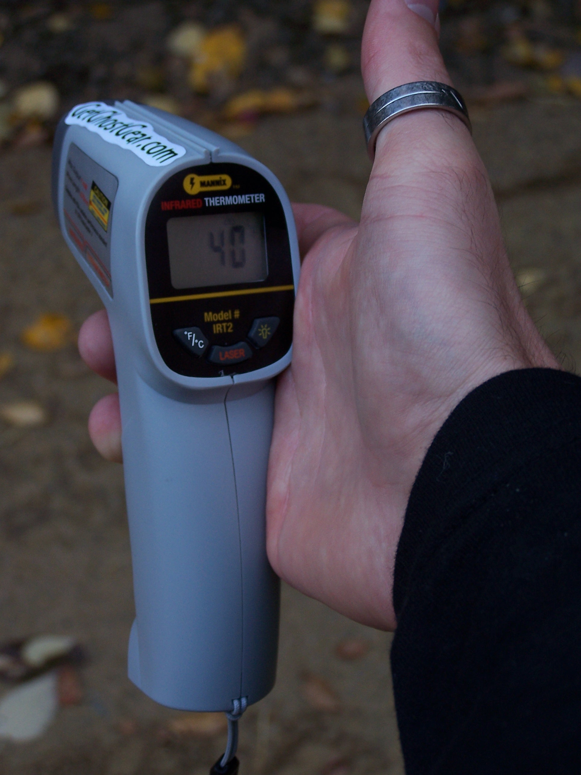 Infrared thermometers held in ghost hunters hand